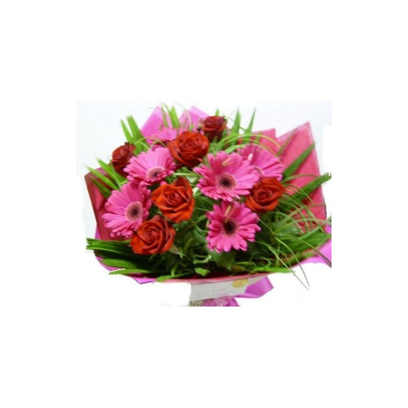 A vibrant mix of gerberas and roses presented in a bouquet